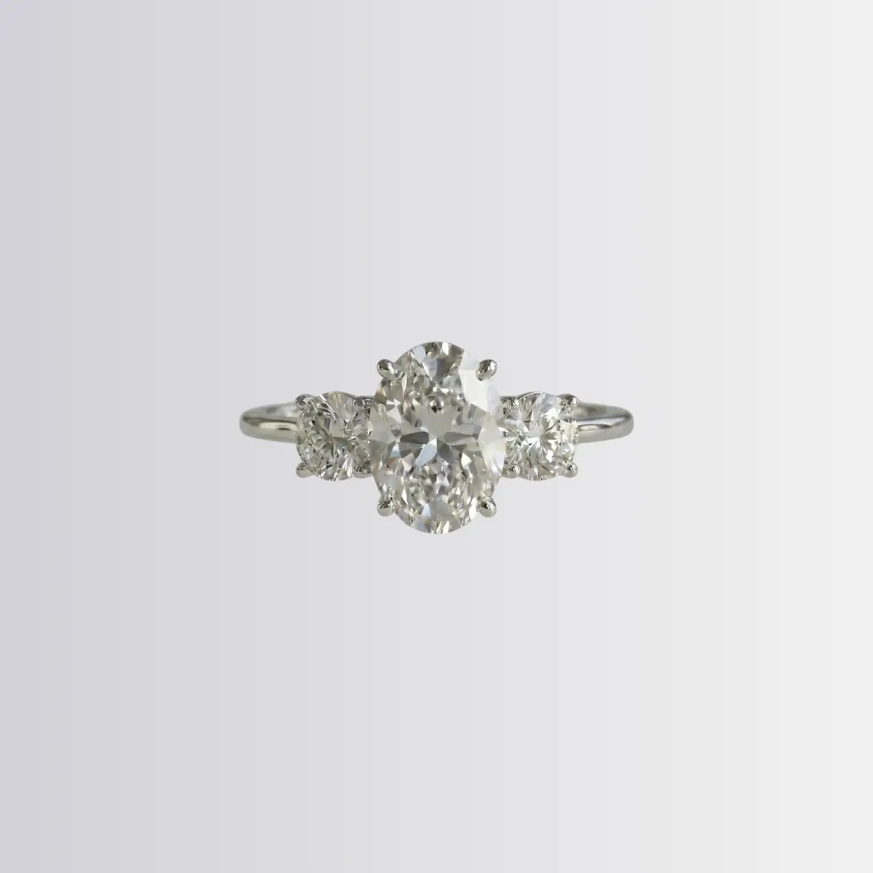 Lab Diamond Oval Trilogy - Round Engagement Ring