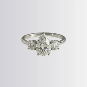 Lab Diamond Pear Trilogy - Round Engagement Ring
